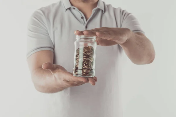 Imagem Cortada Homem Segurando Frasco Moedas Mãos Isoladas Branco Conceito — Fotografia de Stock