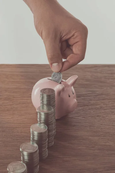 Cropped Image Man Putting Coin Piggy Bank Wooden Table Saving — Stock Photo, Image