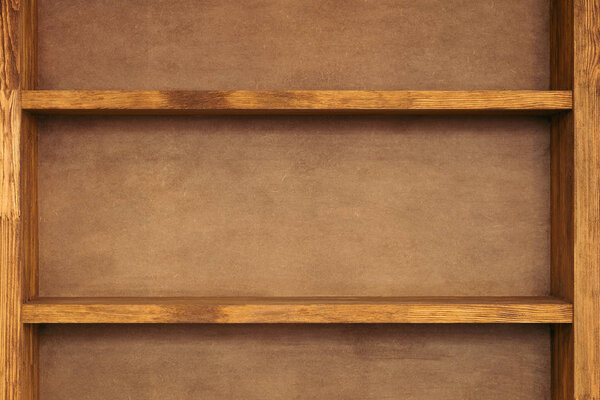 close-up view of empty wooden shelves background