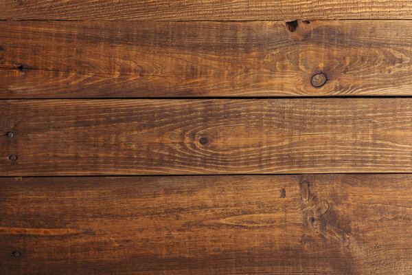 close-up view of dark brown wooden planks background  