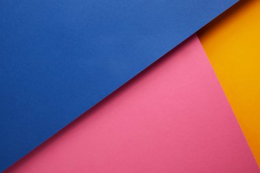 background with blue, pink and yellow papers