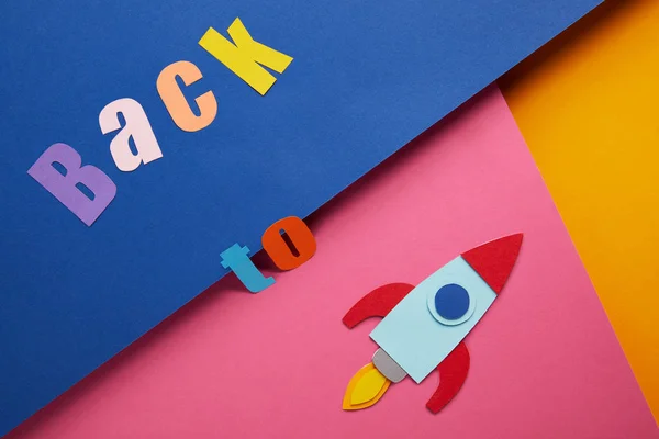 Flat Lay Back Lettering Rocket Colorful Paper Background — Stock Photo, Image