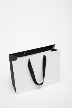 one open black and white shopping bag isolated on white clipart