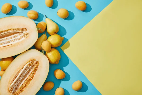 Sweet Ripe Melon Pears Lemons Apricots Yellow Blue Background — Stock Photo, Image