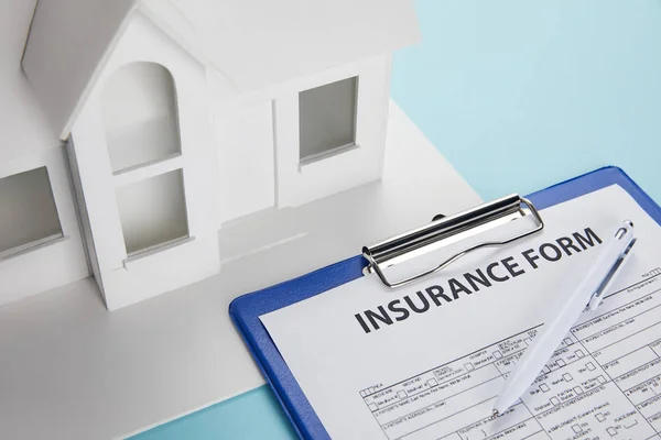Close View Insurance Form Small House Model Clipboard Pen Blue — Stock Photo, Image