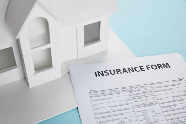 Close View Insurance Form Dan Small House Model Blue — Stok Foto