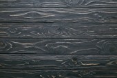 Dark wooden table planks background