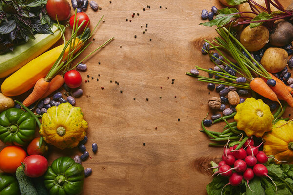 Frame of healthy food vegetables and beans on wooden table