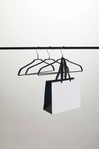 Shopping Bag Empty Hangers Stand Isolated White — Stock Photo, Image