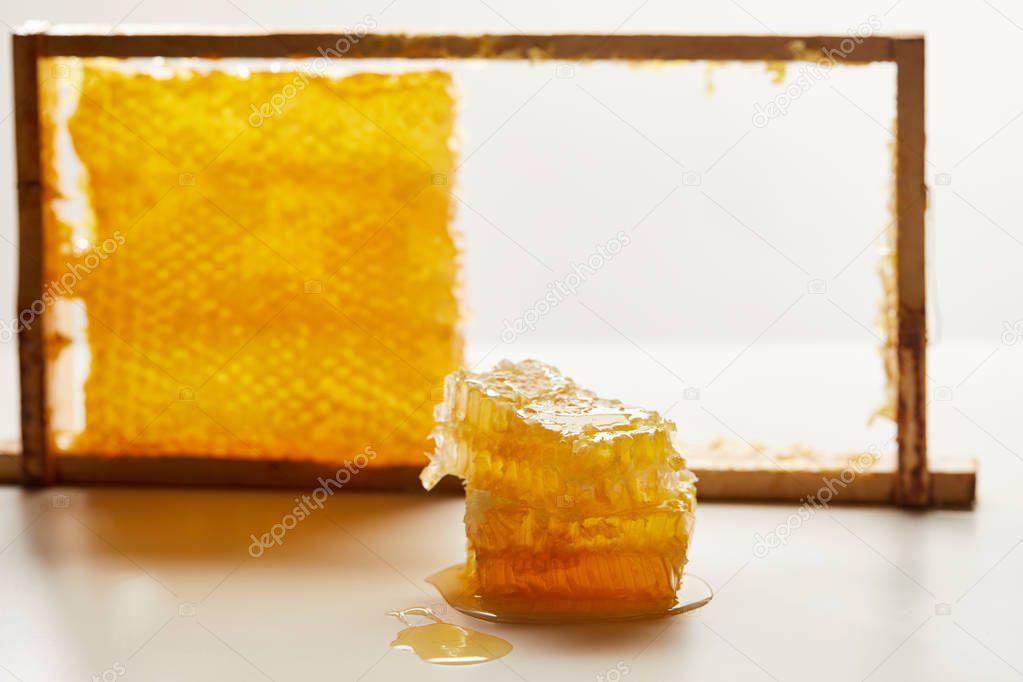 close up view of pile of beeswax on white tabletop