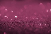 abstract background with purple glitter and bokeh