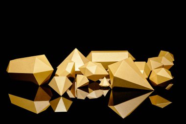 shiny glittering faceted pieces of gold reflected on black clipart