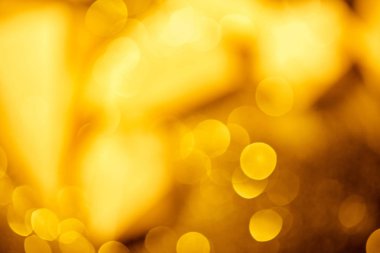 golden festive bokeh on black background  clipart