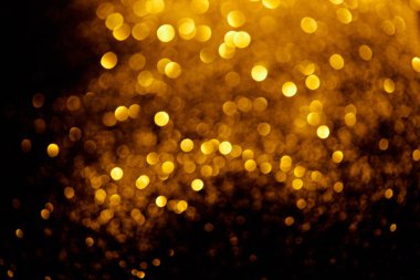 abstract background with blurred glowing golden glitter   clipart