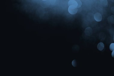 blue bokeh on black background with copy space clipart