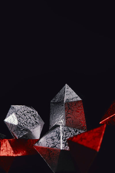 red and silver glittering gems on black background