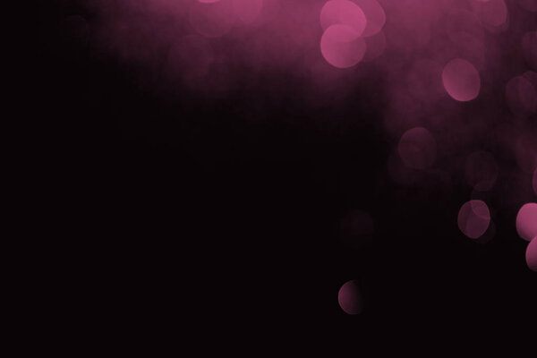 фиолетовый боке на черном фоне для празднования
 