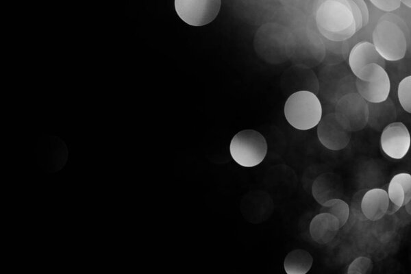 abstract dark background with beautiful sparking silver bokeh