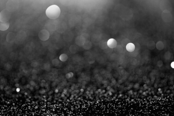abstract background with shiny silver glitter and bokeh