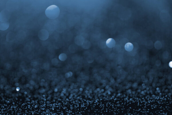 abstract blue glitter with bokeh on background