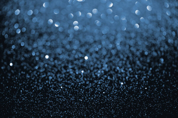 abstract dark blue glitter with defocused background