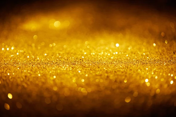 Abstrakt Glänzendes Gold Glitzert Auf Dunklem Hintergrund — Stockfoto
