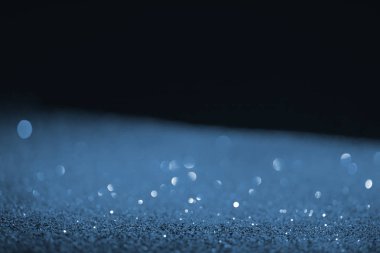 black background with blue glitter and bokeh clipart