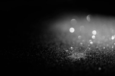 blurred shiny silver glitter on dark background clipart