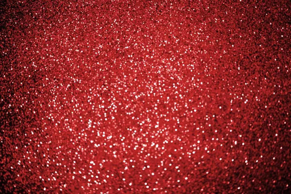 光沢のある赤いキラキラ装飾が施された抽象的な背景 — ストック写真