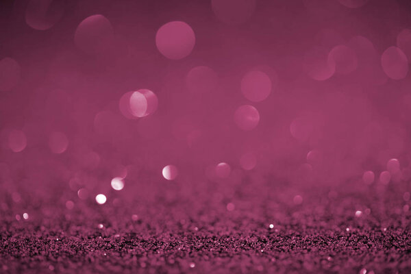 abstract purple glitter with bokeh on background