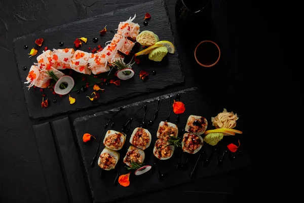 Top View Delicious Fresh Sushi Rolls Slate Boards Chopsticks — Stock Photo, Image