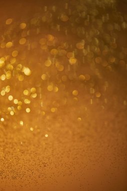 golden bokeh christmas background with falling glittering sequins clipart
