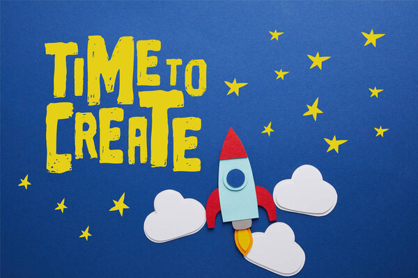 clouds and rocket on blue background with "time to create" inspiration  