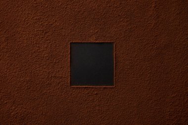 top view of gourmet cocoa powder with square copy space on black background  clipart