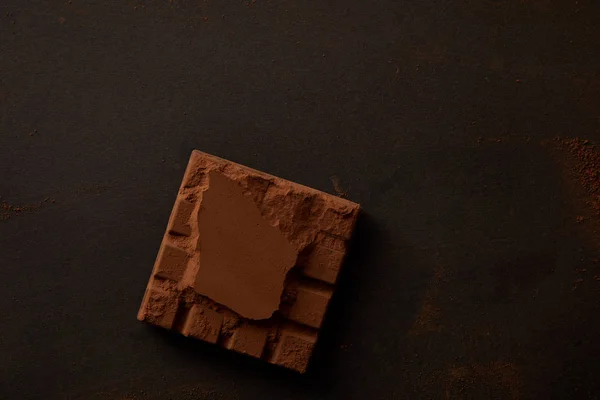 Vista Superior Chocolate Dulce Delicioso Sobre Fondo Negro — Foto de stock gratis