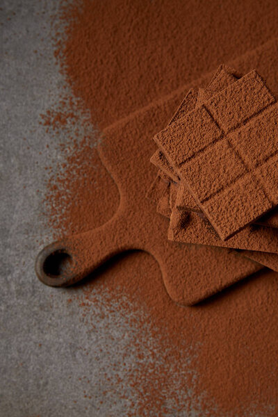 Top View Sweet Tasty Chocolate Pieces Cocoa Powder Chopping Board Royalty Free Stock Images