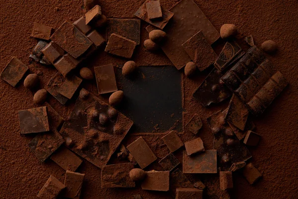 Top View Chocolate Pieces Nuts Cocoa Powder Dark Background — Stock Photo, Image