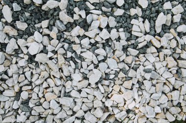 top view of white small scattered stones on ground clipart