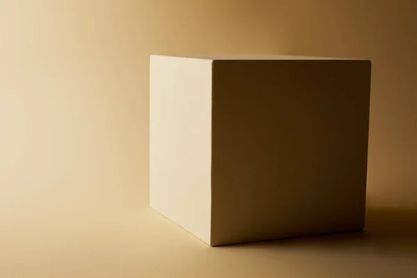 Close Shot Cube Beige Surface — Free Stock Photo