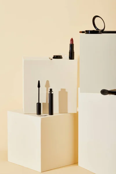 Various Makeup Supplies Lying Beige Cubes — Stock Photo, Image