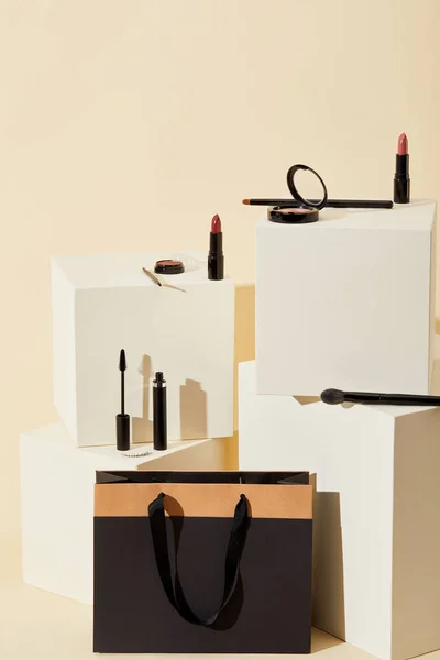 Various Makeup Supplies Lying Beige Cubes Paper Bag — Stock Photo, Image