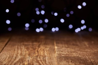 close up view of wooden tabletop and defocused bokeh lights backdrop clipart