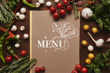 top view of menu and fresh vegetables with herbs on wooden surface  clipart