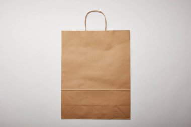 top view of food delivery paper bag on white surface, minimalistic concept  clipart