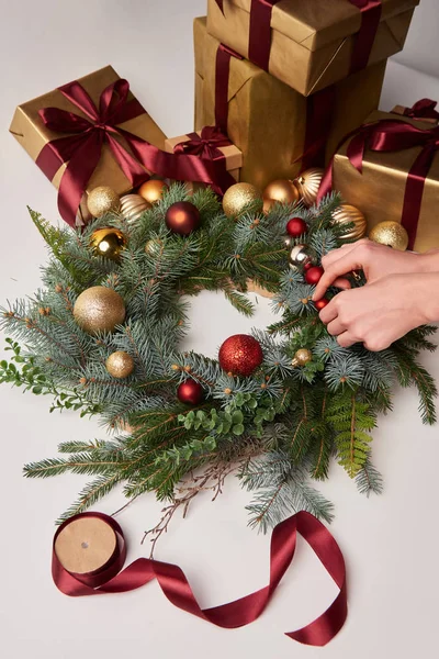 Cropped Image Woman Putting Christmas Balls Fir Wreath Isolated White — Stock Photo, Image