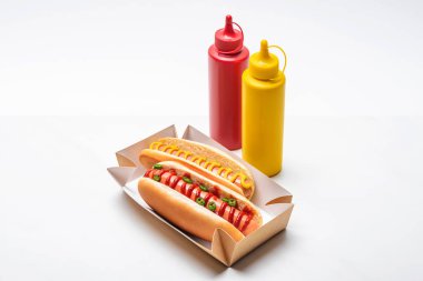 close-up shot of delicious hot dogs with mustard and ketchup on white clipart