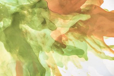 beautiful brown and green splashes of alcohol inks as abstract background clipart