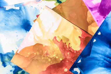 brown and blue splashes of alcohol inks as abstract background clipart