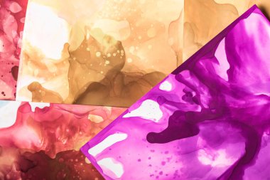 brown, violet and red splashes of alcohol inks as abstract background clipart