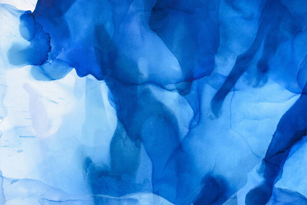 blue splashes of alcohol ink as abstract background